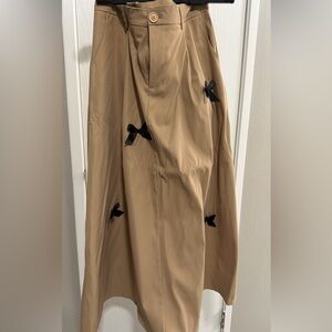 Chic Tan A-Line Skirt with Black Bow Details